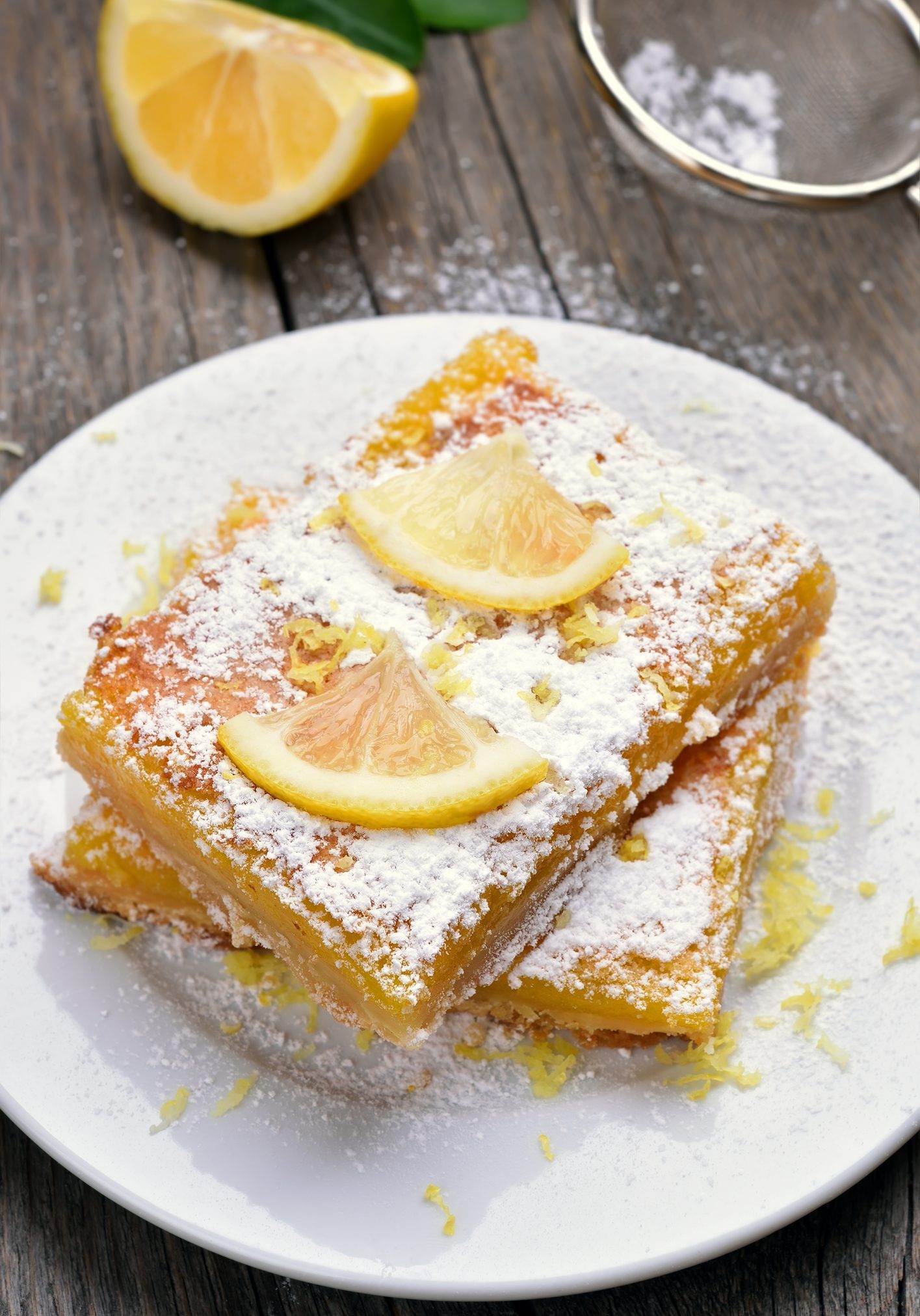 Baking sliced lemon bars pie on white plate